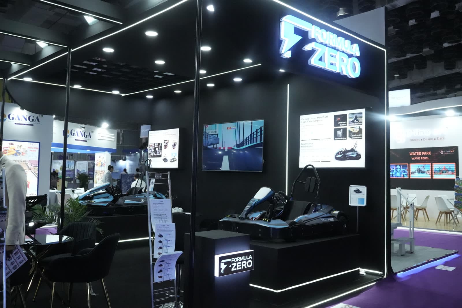 Formula-Zero booth with karts and signage