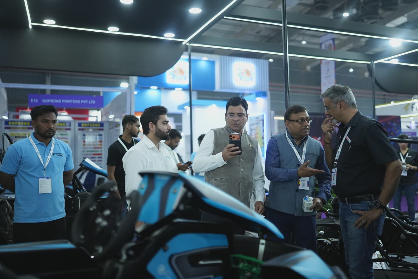 Visitors examining Formula-Zero kart