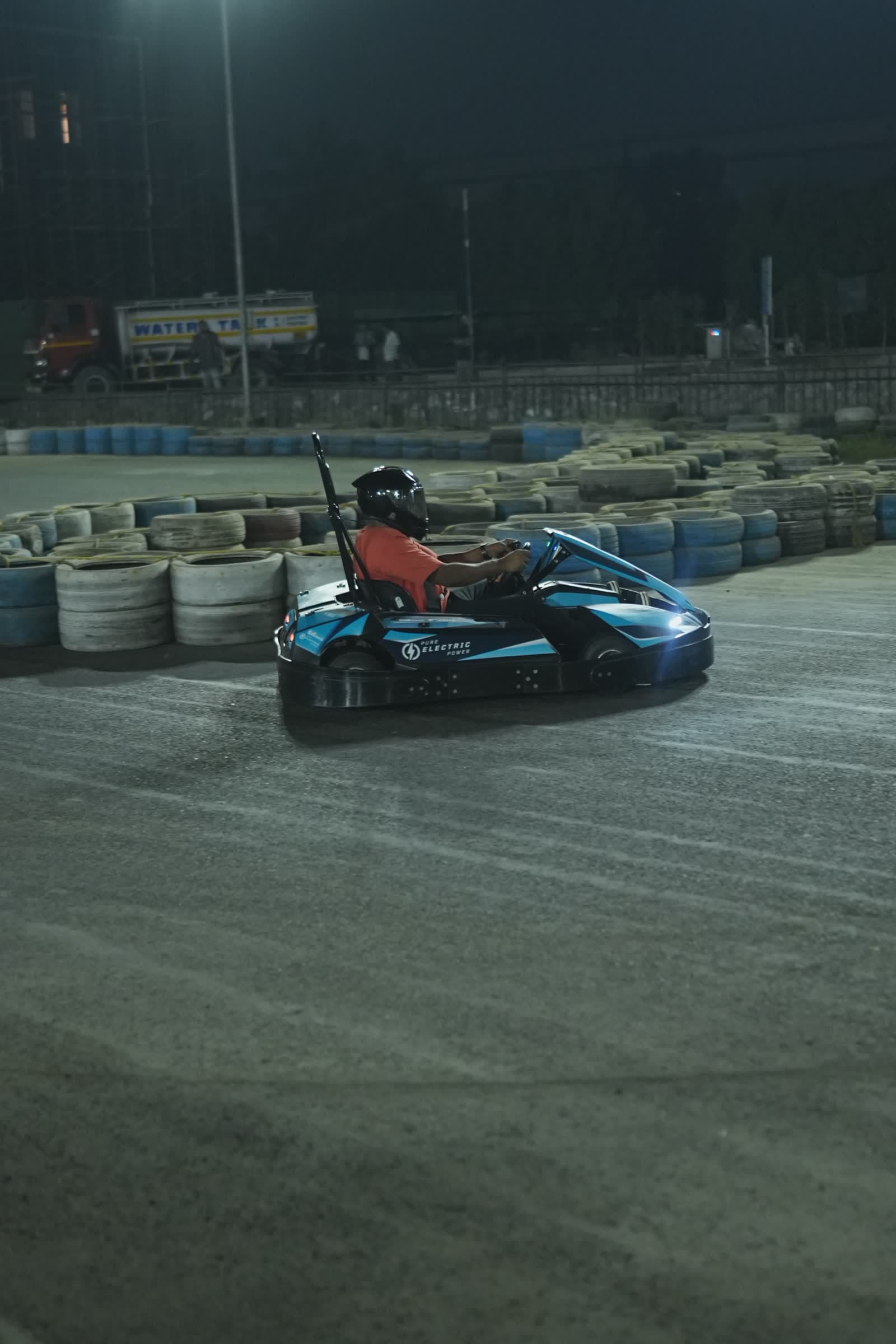Electric karts racing at night