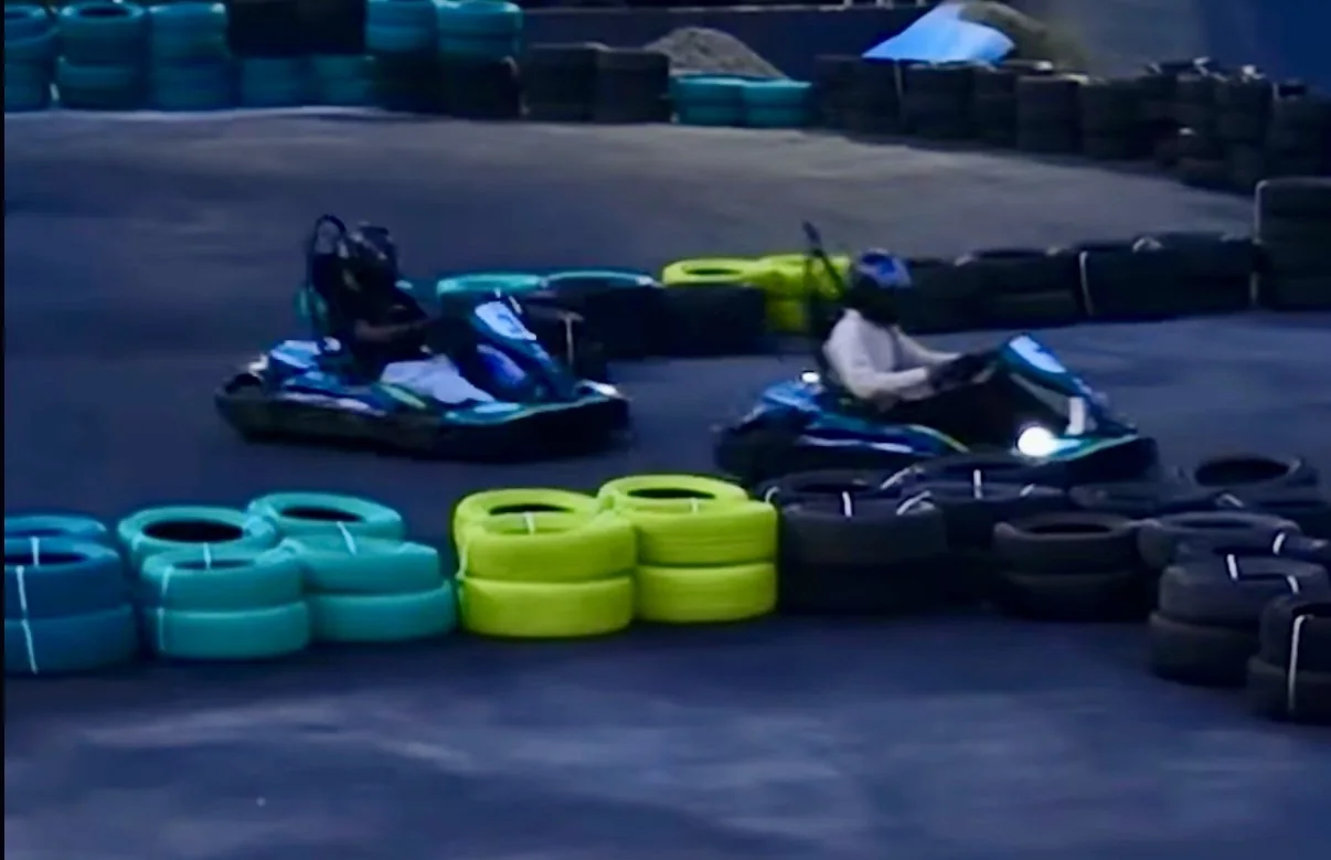 Two Formula-Zero MK2 electric karts racing through The Grid Karting Club in Chennai
